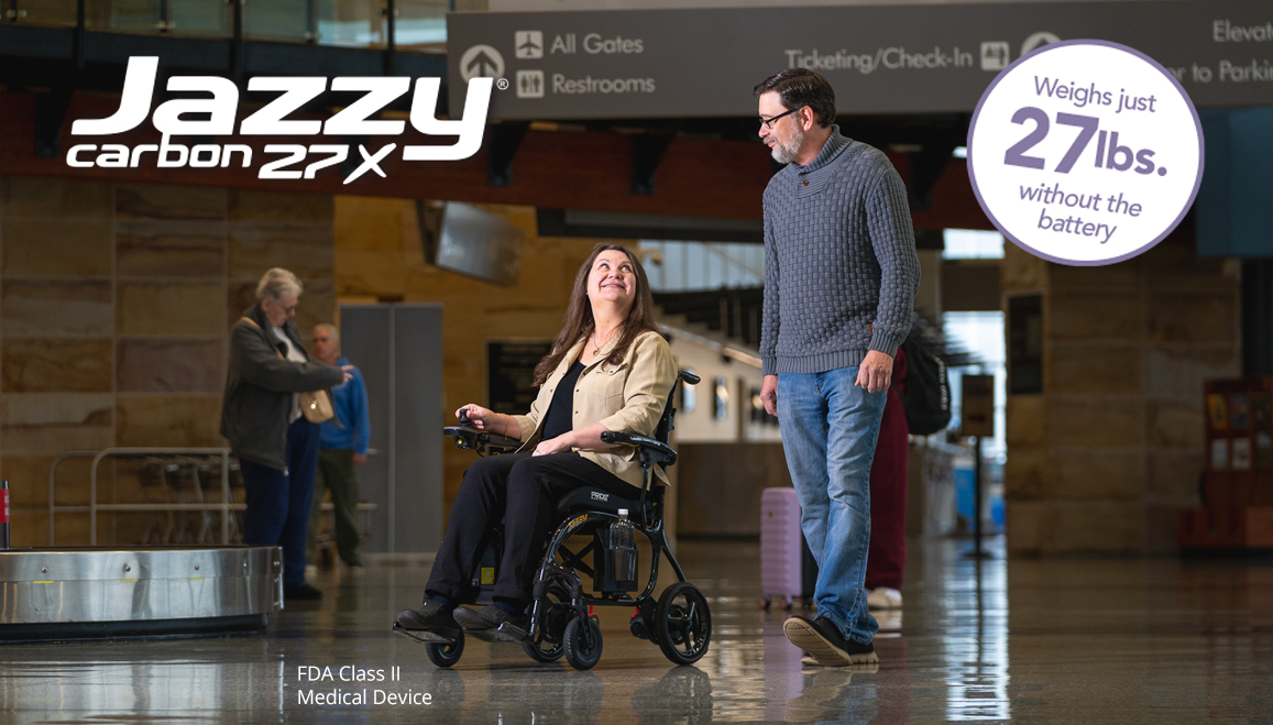 Jazzy Carbon 27X user traveling through an airport